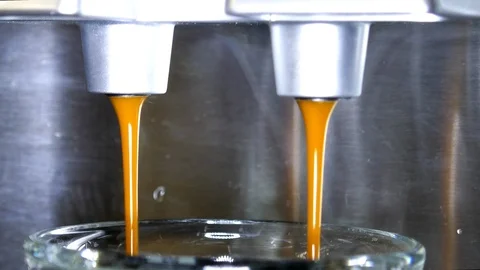 Espresso machine that grinds beans making espresso coffee 4k intro Stock Footage 98403354