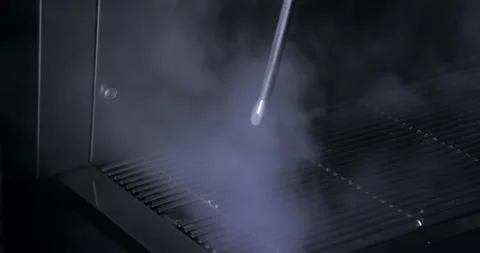 An espresso machine letting off some steam in slow motion in a coffee shop. Stock Footage 211433522