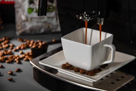 Espresso machine for making fresh coffee on a dark background. Stock Photos