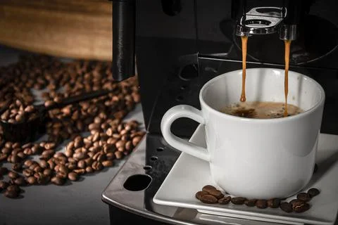 Espresso machine for making fresh coffee on a dark background. Stock Photos