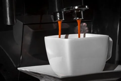 Espresso machine for making fresh coffee on a dark background close-up. Stock Photos