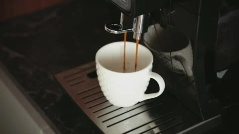 Espresso machine pouring fresh black coffee close-up white cup, porcelain mug Stock Footage 334656935