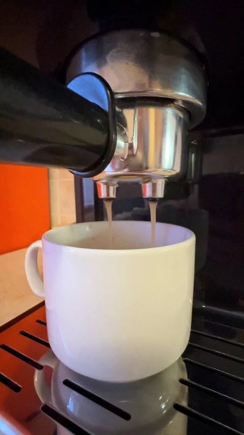 Espresso machine with white cup of coffee in the home kitchen background.  Stock Footage 315220089