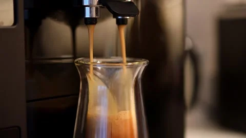 An espresso is made by a modern coffee machine 4k 25fps video 動画素材 259324154