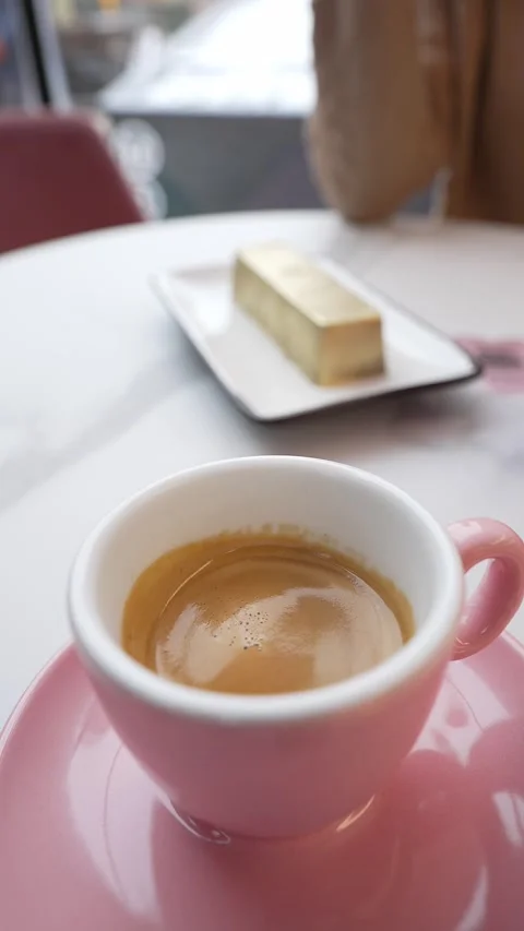 Espresso in pink cup with cake. Coffee break concept.. Stock Footage 288031541