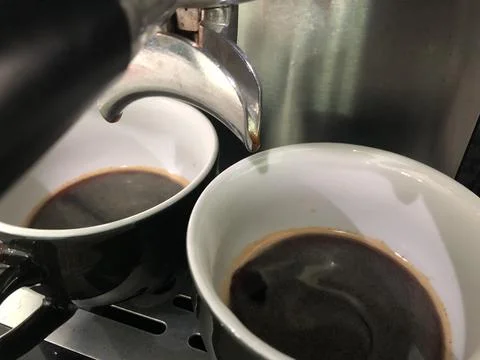 Espresso process using a coffee machine Stock Photos