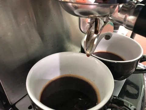Espresso process using a coffee machine Stock Photos