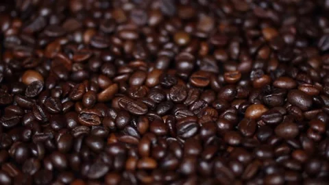 Espresso roasted coffee beans isolated in black background close up Stock Footage 237350339