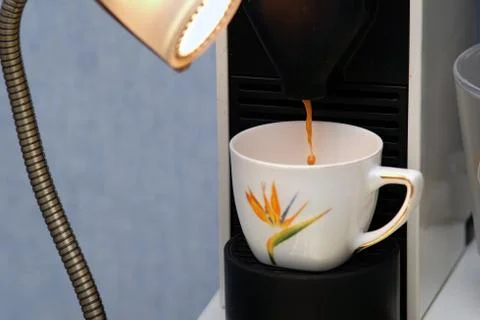 Espresso running from coffee machine 写真素材