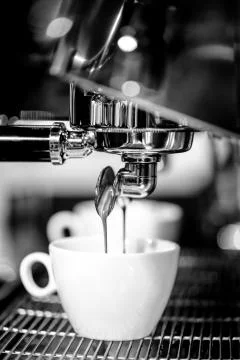 Espresso shot from coffee machine in coffee shop,Coffee maker in coffee shop Stock Photos