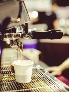 Espresso shot from coffee machine in coffee shop,Coffee maker in coffee shop Stock Photos