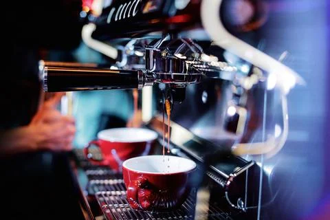 Espresso shot from coffee machine in coffee shop,Coffee maker in coffee shop Stock Photos