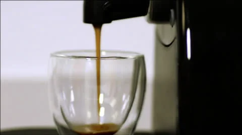 Espresso into a shot glass 스톡 동영상 22998619