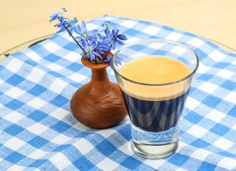Espresso with spring flower Stock Photos