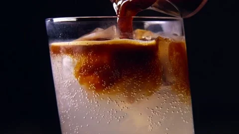 Espresso Tonic making - pouring coffee into sparkling water Stockbeeldmateriaal 137420489