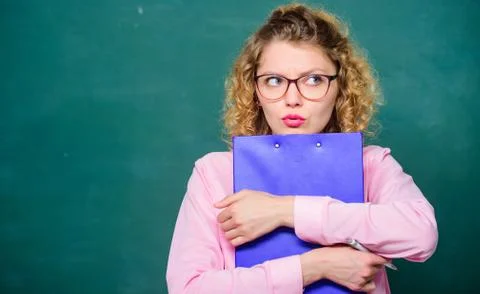 Essay writing. teacher with document folder. girl teacher at private lesson Stock Photos