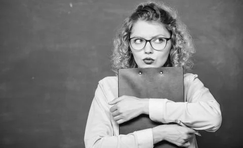 Essay writing. teacher with document folder. girl teacher at private lesson Stock Photos