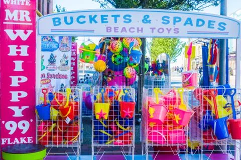 Essential beach plastic tools for kids in outdoor shop Southport Stock Photos