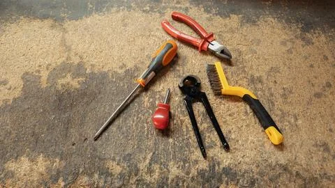 Essential hand tools lying on workbench in workshop Stock Photos