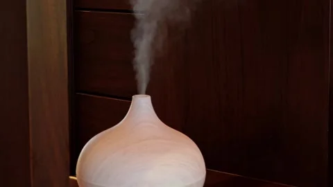 Essential oil aroma diffuser and humidifier. Soft focus. Stock Footage 307918604