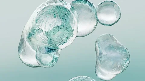 Essential Oil Bubbles for cosmetics in water. blue liquid bubbles, fluid flow Stock Footage 282013476