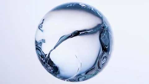Essential Oil Bubbles for cosmetics in water. blue liquid bubbles, fluid flow. Stock Footage 309779647