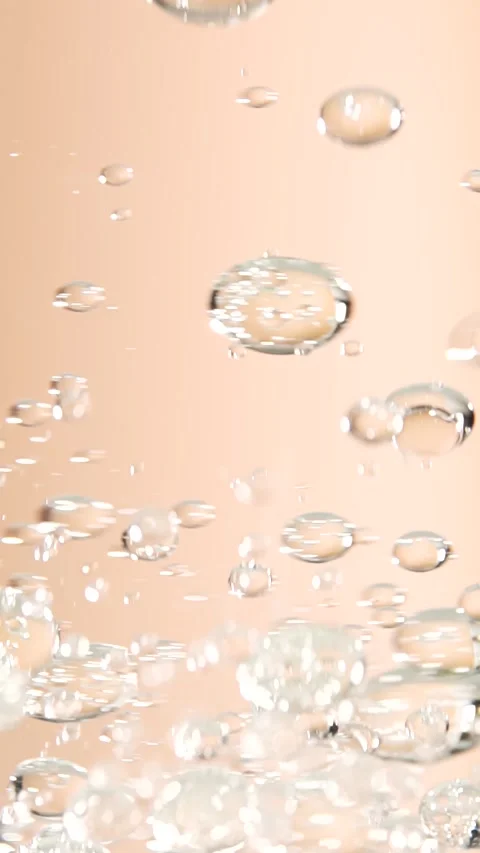 Essential oil bubbles, macro shot, cosmetics concept. Golden liquid bubbles.. Stock Footage 300833576