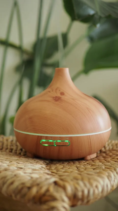 Essential oil diffuser creates a soothing aroma indoors Stock Footage 328134279
