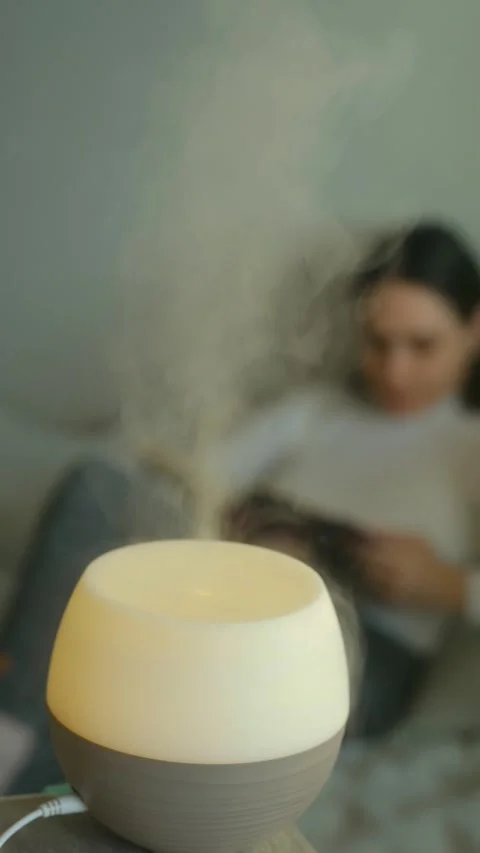 Essential oil diffuser emitting steam for aromatherapy Stock Footage 323896623