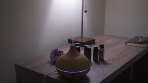 Essential Oil Diffuser misting with changing colors. Video stock 104169789