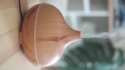 Essential oil diffuser releasing mist in quiet room, therapeutic aroma. Stock Footage 333158741