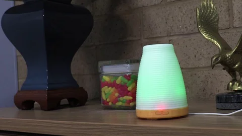 Essential Oil Diffuser on a Work Desk in an Office Video stock 129689982