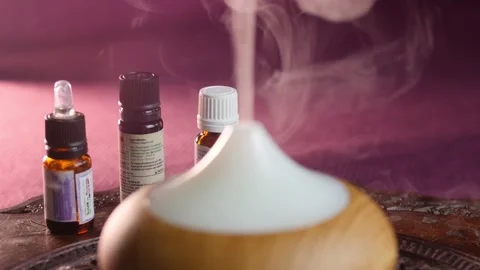 Essential oil diffuser working and essential oil bootles Stock Footage 144247009
