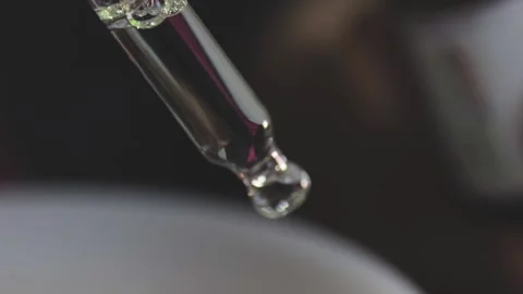 Essential oil drops, macro of distribution of essential oil into the diffuser Stock Footage 144246911