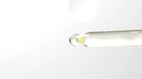 Essential oil in pipette driping on a surface. Dropper for cosmetic fluid w.. Stock Footage 305073110