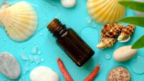 Essential oil on sea background. Selective focus. Stock Footage 205540187