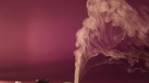 Essential oil smoke and diffuser. Nice vertical pan from smoke to diffuser Stock Footage 144246957