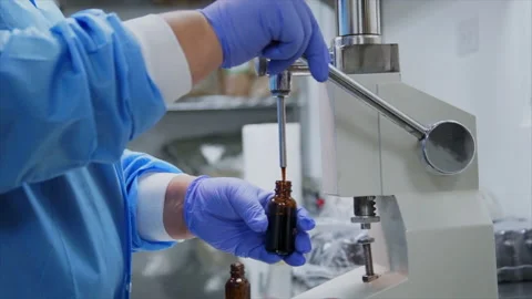 Essential Oils Bottle Dispenser in Lab Stock Footage 197589931