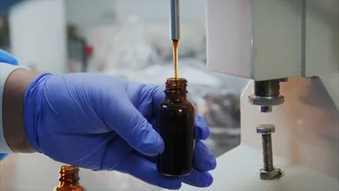 Essential Oils Bottle Dispenser in Lab Stock Footage 199117290