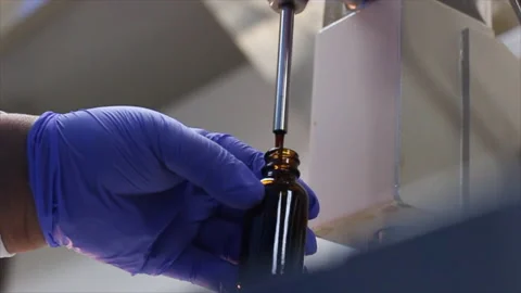 Essential Oils Bottle Dispenser in Lab Stock Footage 199322501