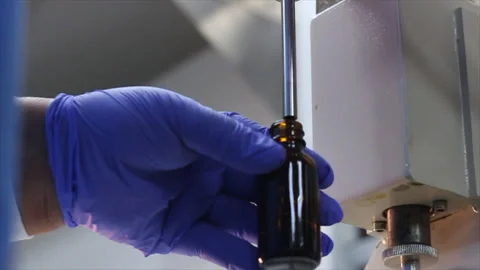 Essential Oils Bottle Dispenser in Lab Stock Footage 199336557