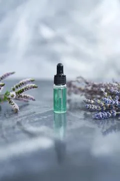 Essential oils on the grey background Stock Photos