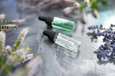 Essential oils on the grey background Stock Photos