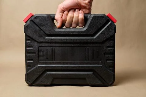 Essential tool case showcasing a handheld power screwdriver for home repairs Stock Photos
