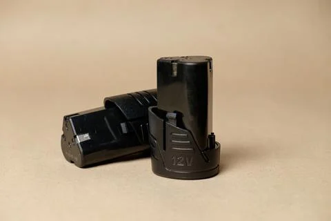 Essential tools for home repairs featuring black battery packs for drills Stock Photos