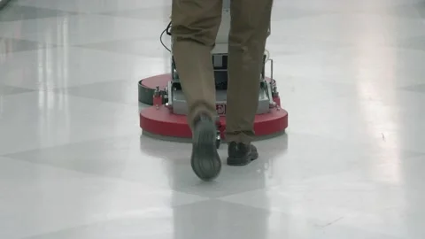 Essential Worker Janitor Employee Cleans &amp; disinfects Hospital Floor Video stock 130471273