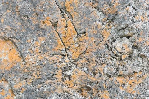 Established limestone boulder rock face with lichen Stock Photos