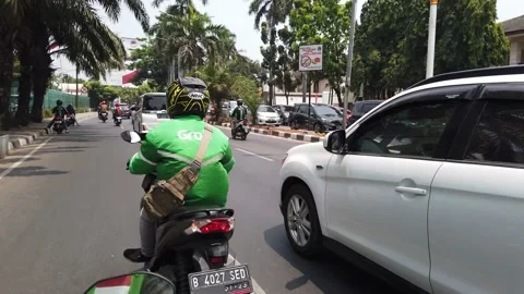 Established Shot of Busy Traffic by Gojek Passanger Point of View Stock Footage