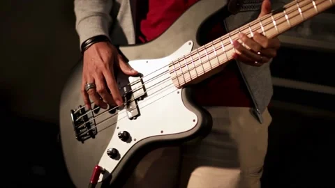 Established Shot of Closeup Bassist in Action Stock Footage 168969953