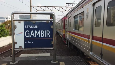 Established Shot of Commuter Line Passes by at Gambir Train Station Video stock 132096232